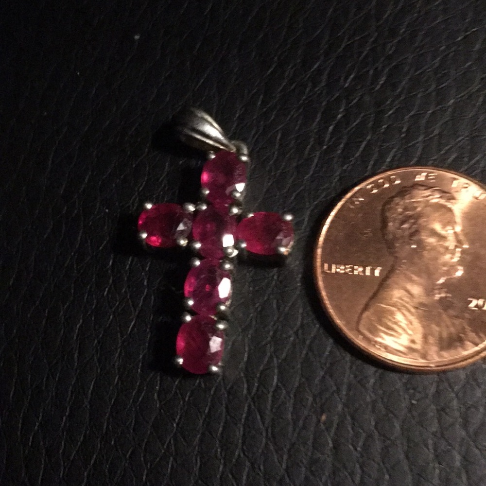 Sterling silver ruby cross pendant.